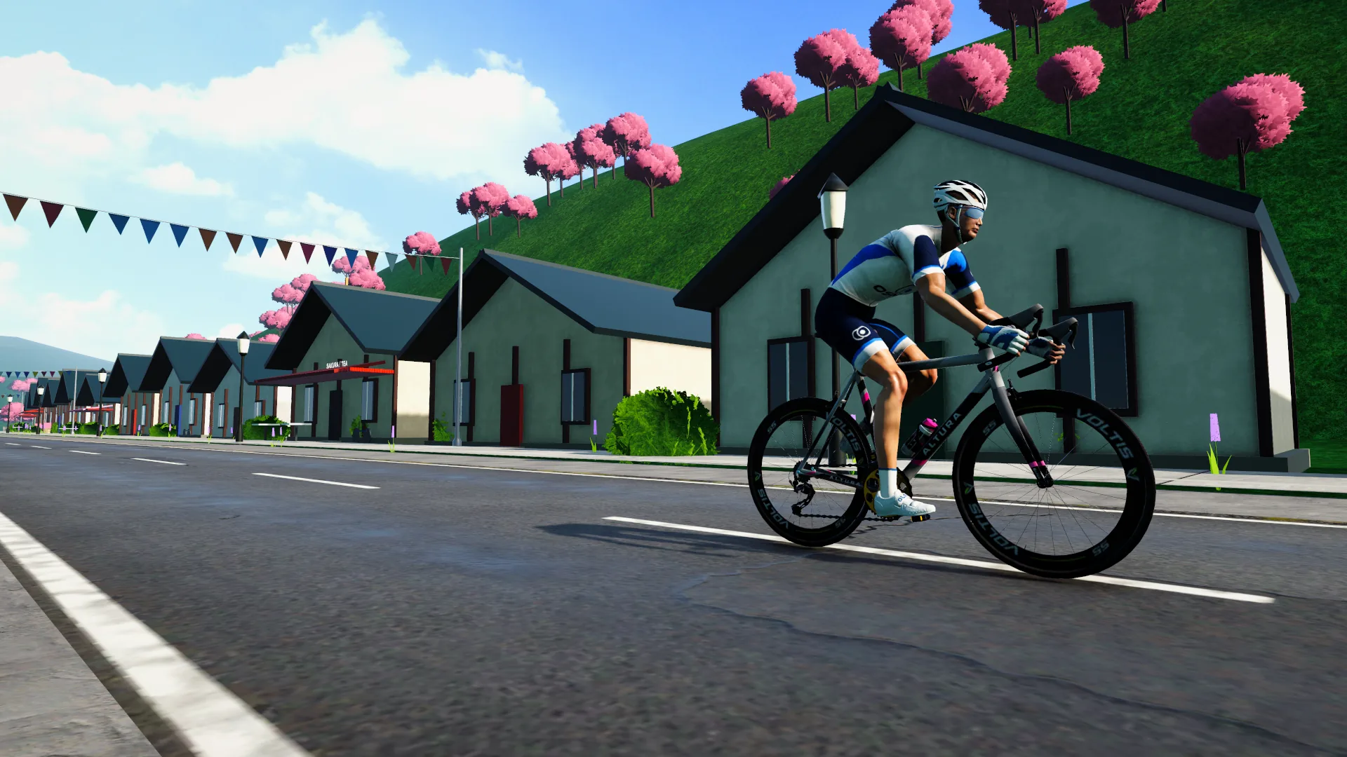 Le même cycliste dans le village de Sakura Valley, au Japon, sous les cerisiers en fleurs